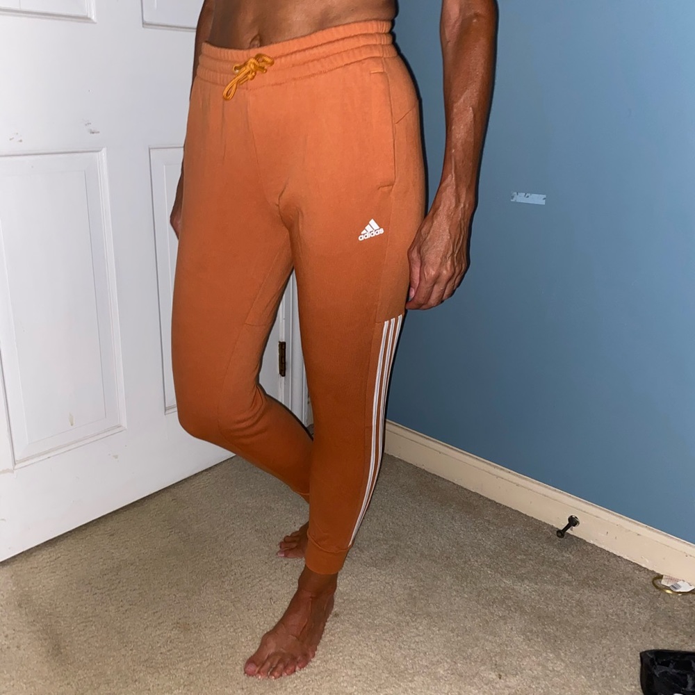 Woman’s Orange Adidas Sweatpants